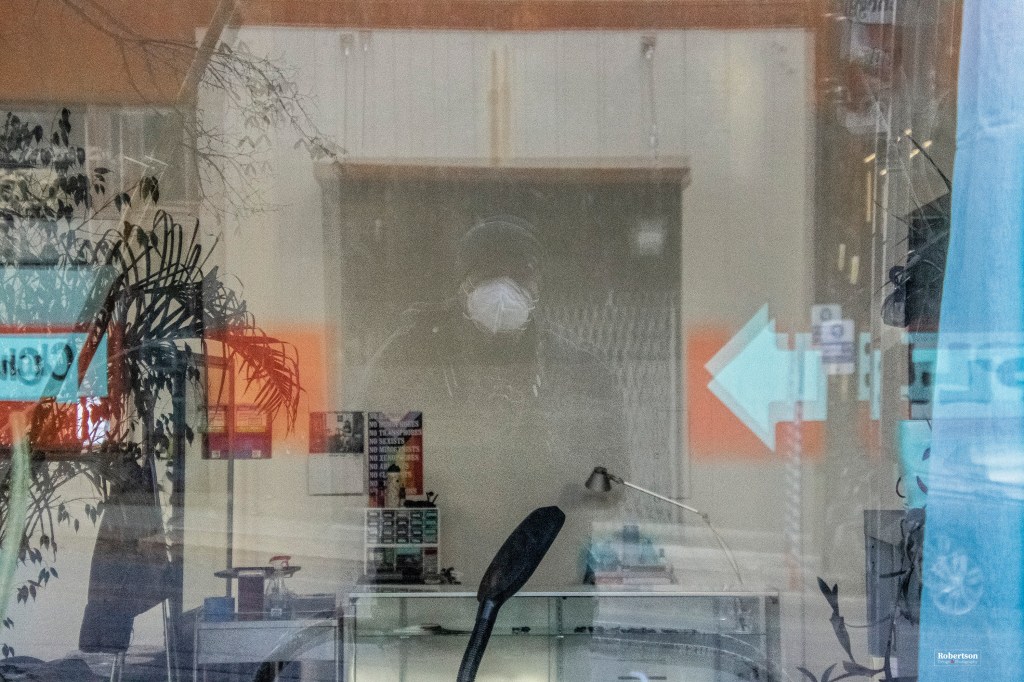 Self portrait of Keith Robertson in store window.